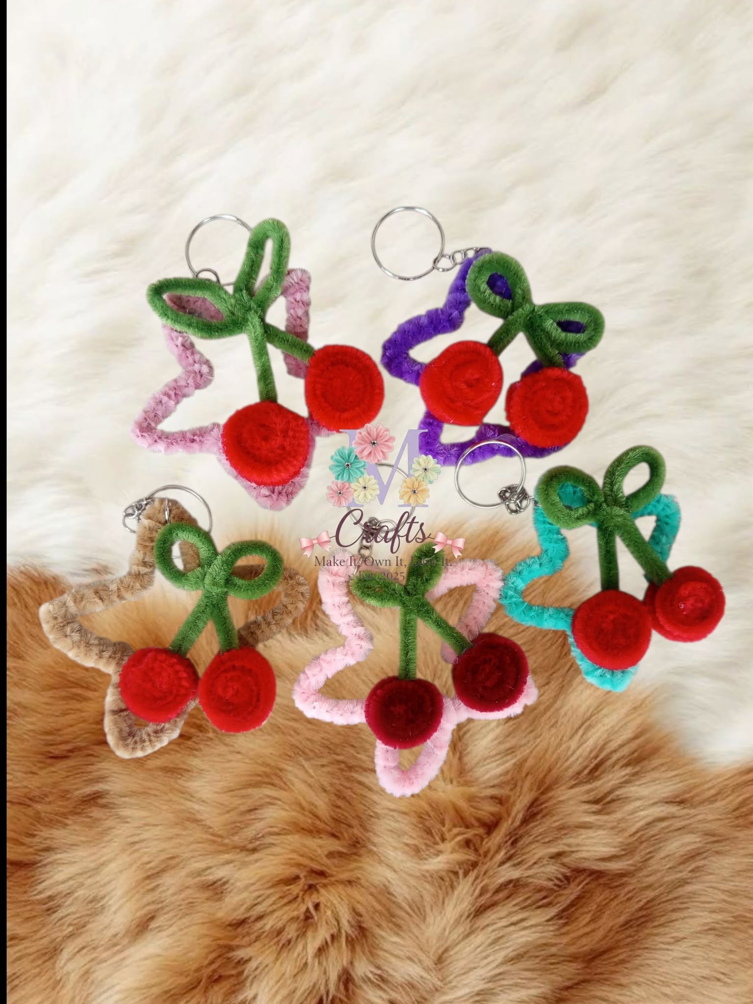 Cherry star keychains in five pastel colourways on fur