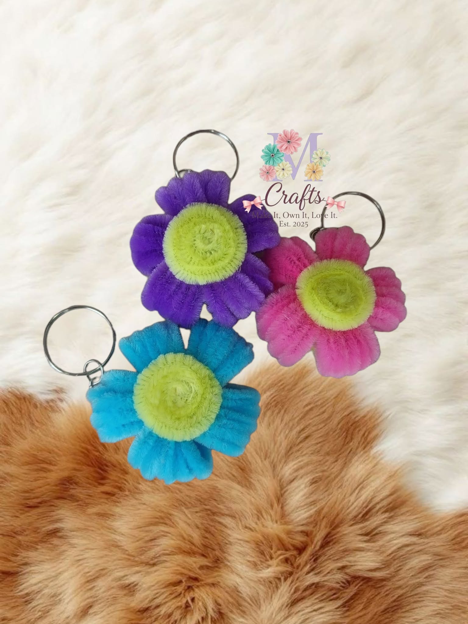Flower keychains in violet, fuchsia and turquoise with lime centres