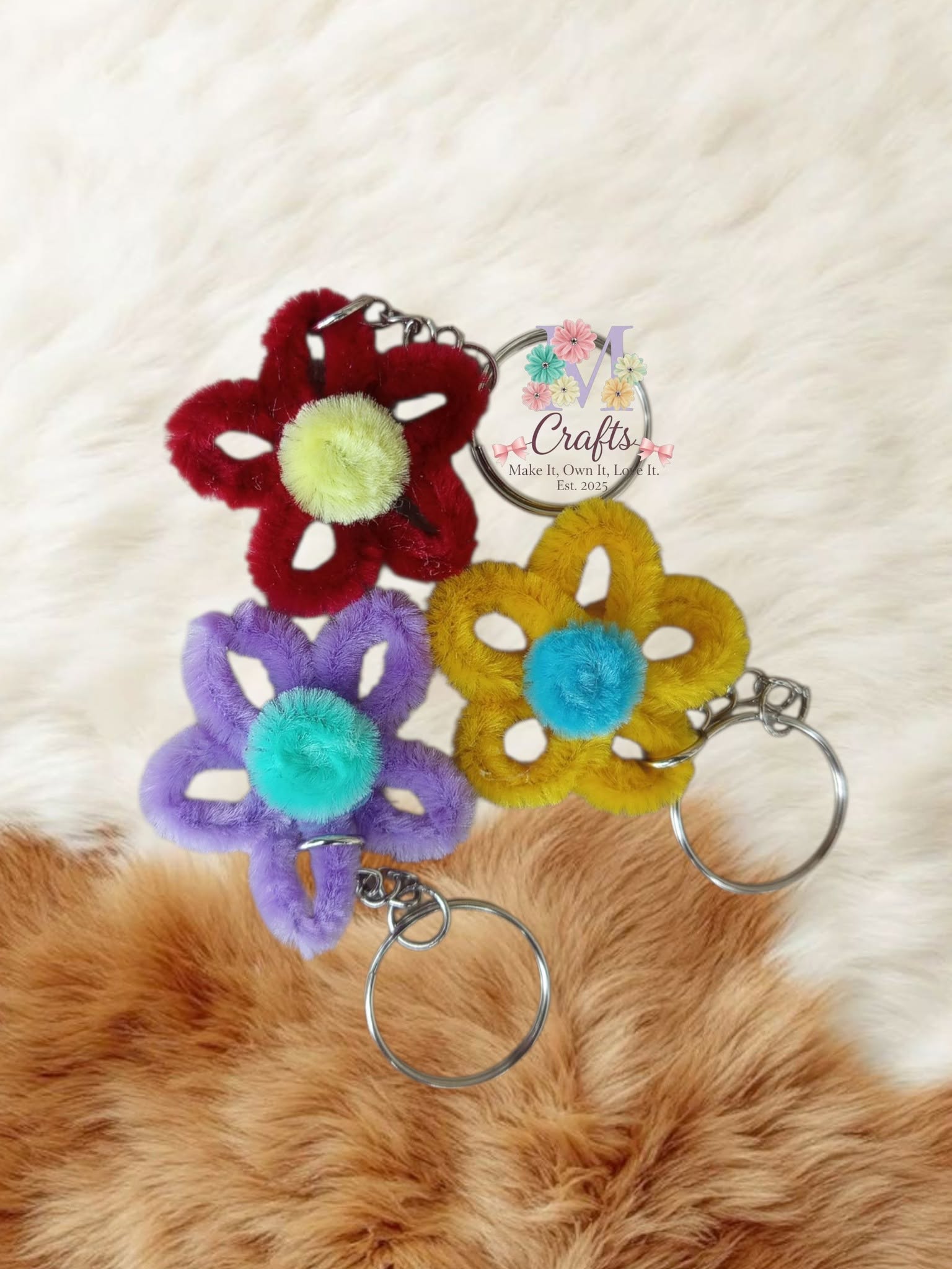 Open petal flower keychains in crimson, lilac and marigold