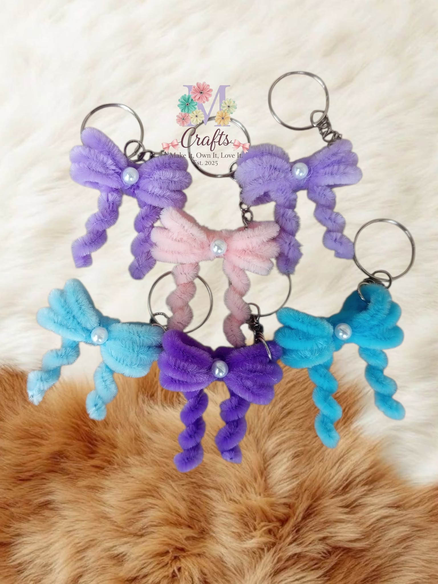 Ribbon bow keychains with pearl centres in lilac, pink, violet and blue